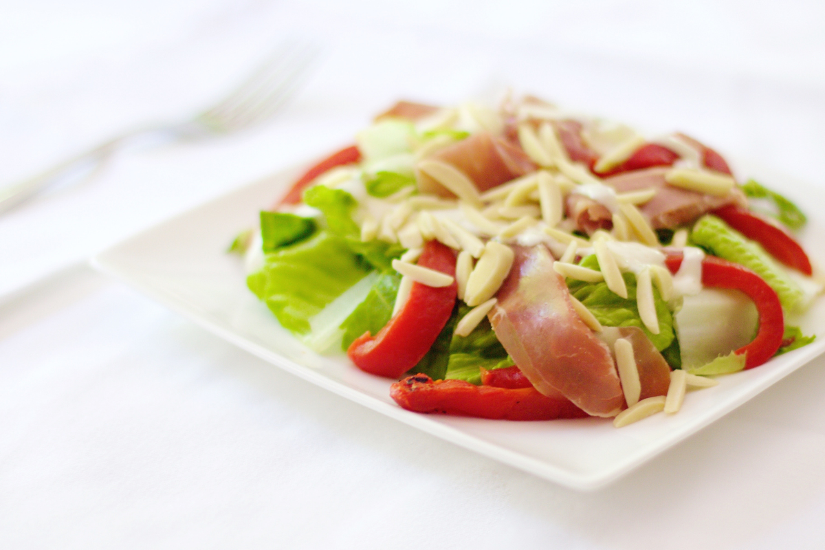 Salad With Prosciutto Roasted Red Peppers And Creamy Almond Dressing